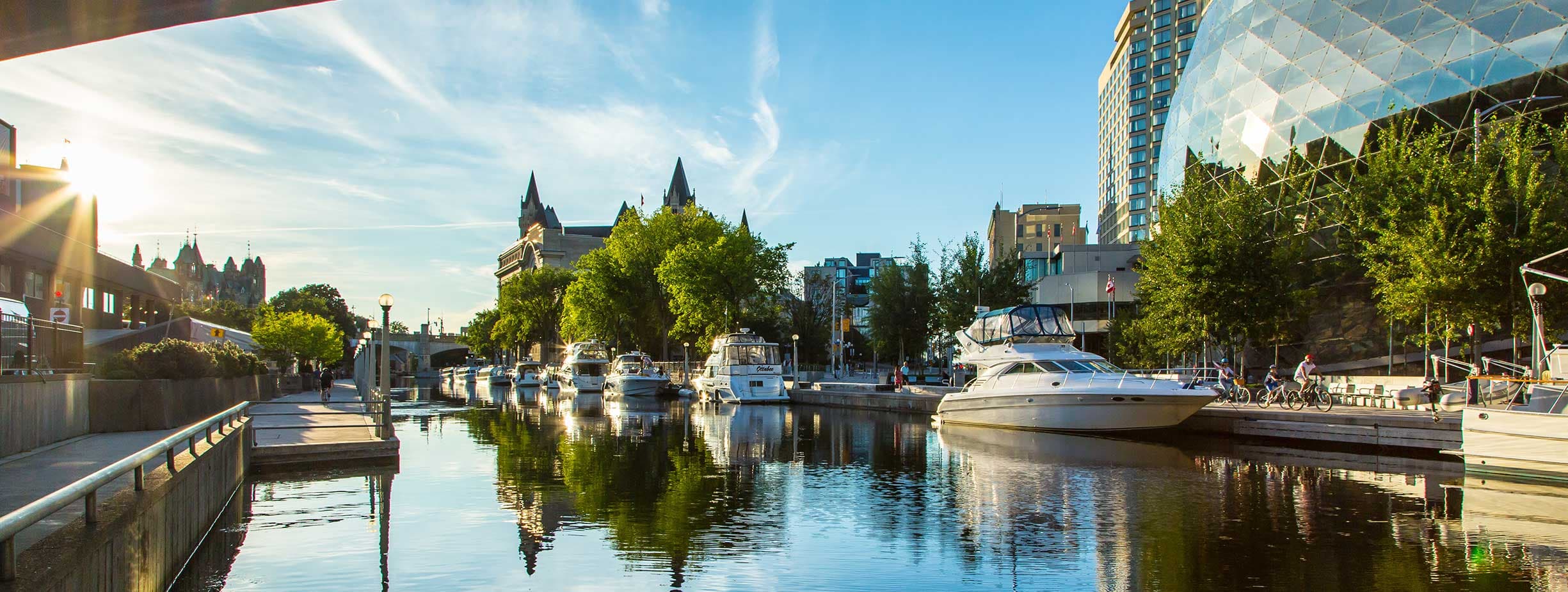 Ottawa Background Image Sunset landscape of Ottawa with the view of the canal, Chateau Laurier, Parliament, NAC and conference center.